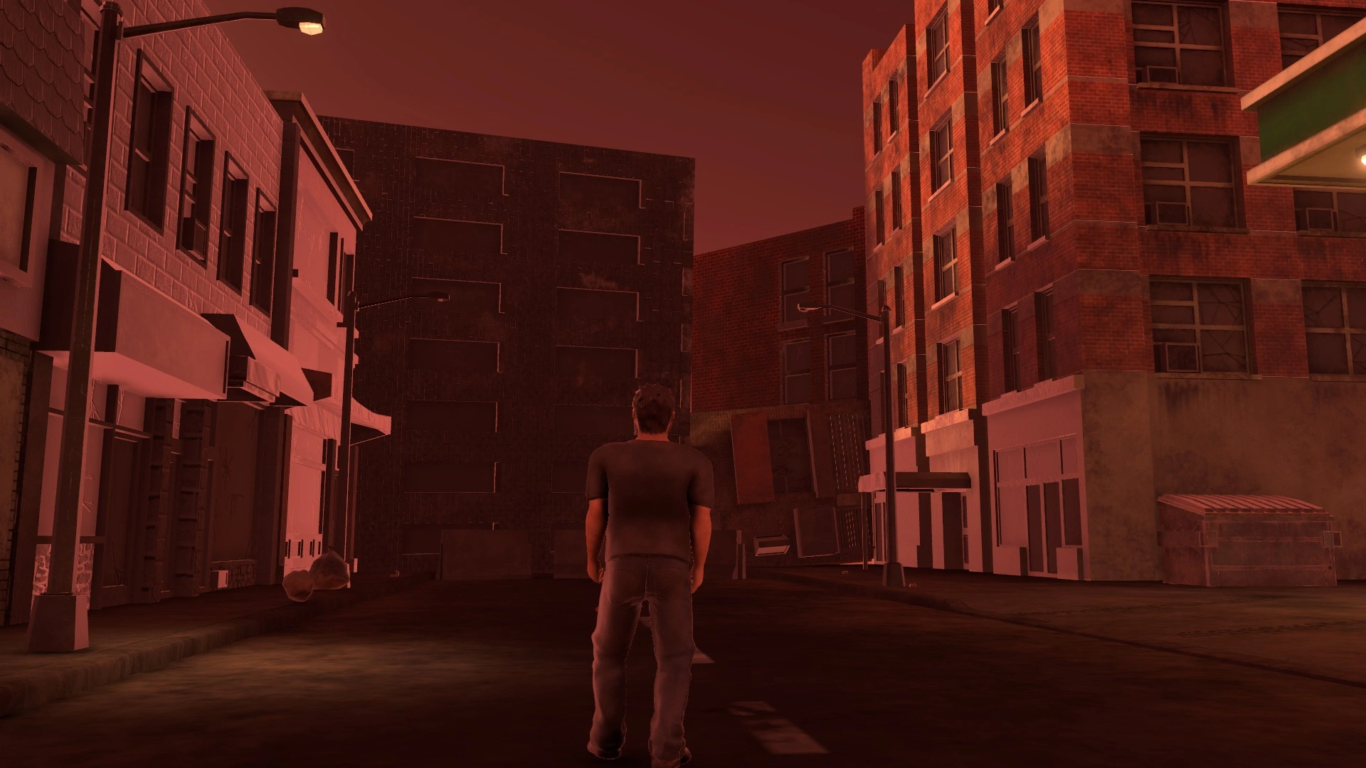 a 3d model of an adult male stands at the end of a post-apocalyptic city block. the exit is blocked by fallen buildings. the city block is covered in a layer of dust and grime. the picture is tinted red