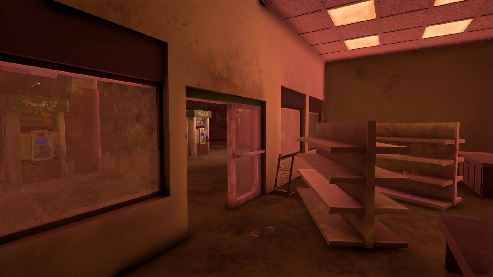 the inside of the post-apocalyptic gas station. the shelves are in disarray, there are broken bottles. the window and door are covered in a layer of dust and grime and the door is slightly cracked. the lights are still on. the shelves are empty. outside of the building gas pumps can be seen. the image is tinted red