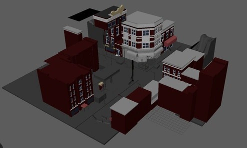 screenshot of basic color coded textures in maya editor of a 3d model group city block. there are different types of buildings.